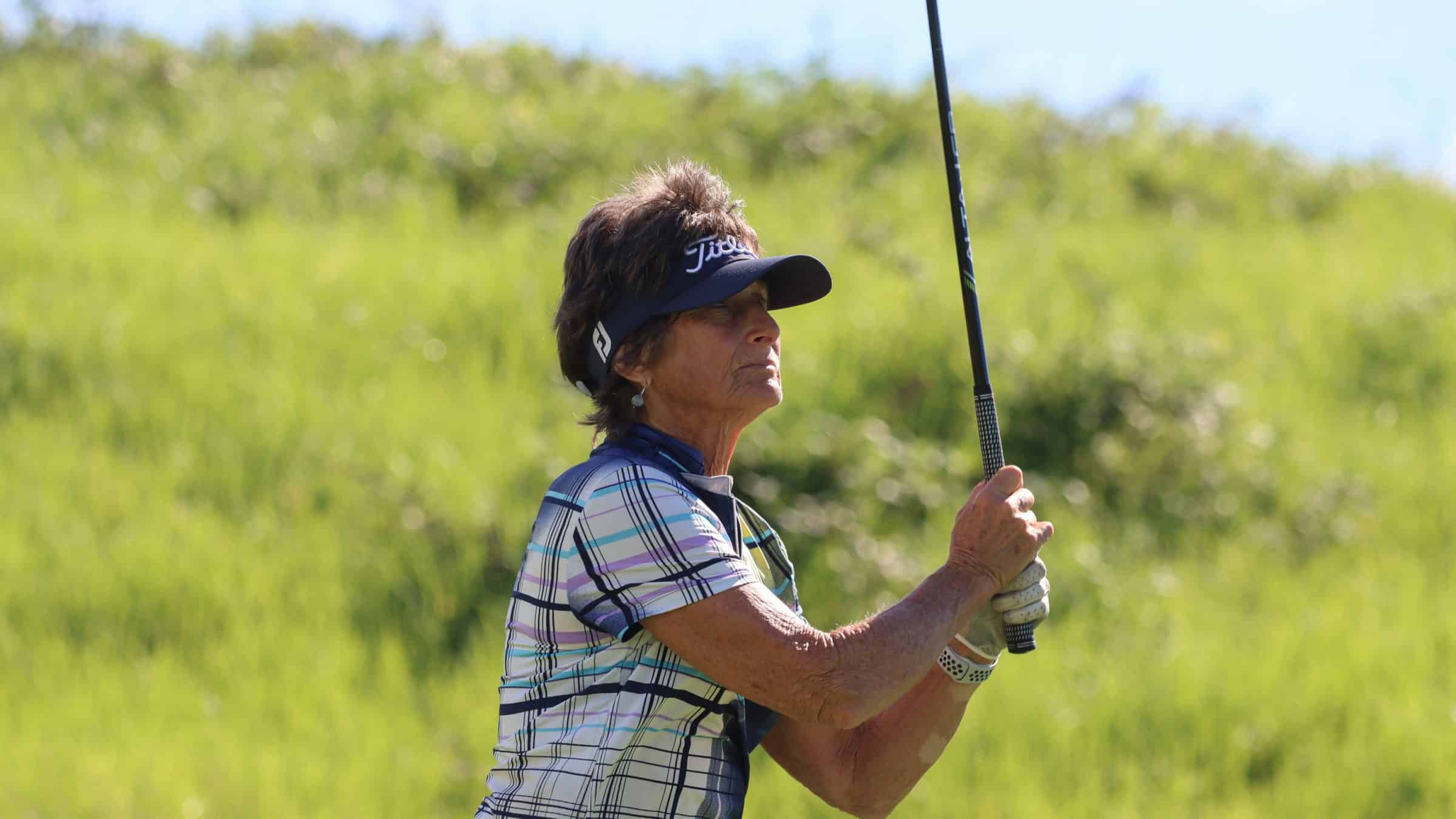 A female teeing off