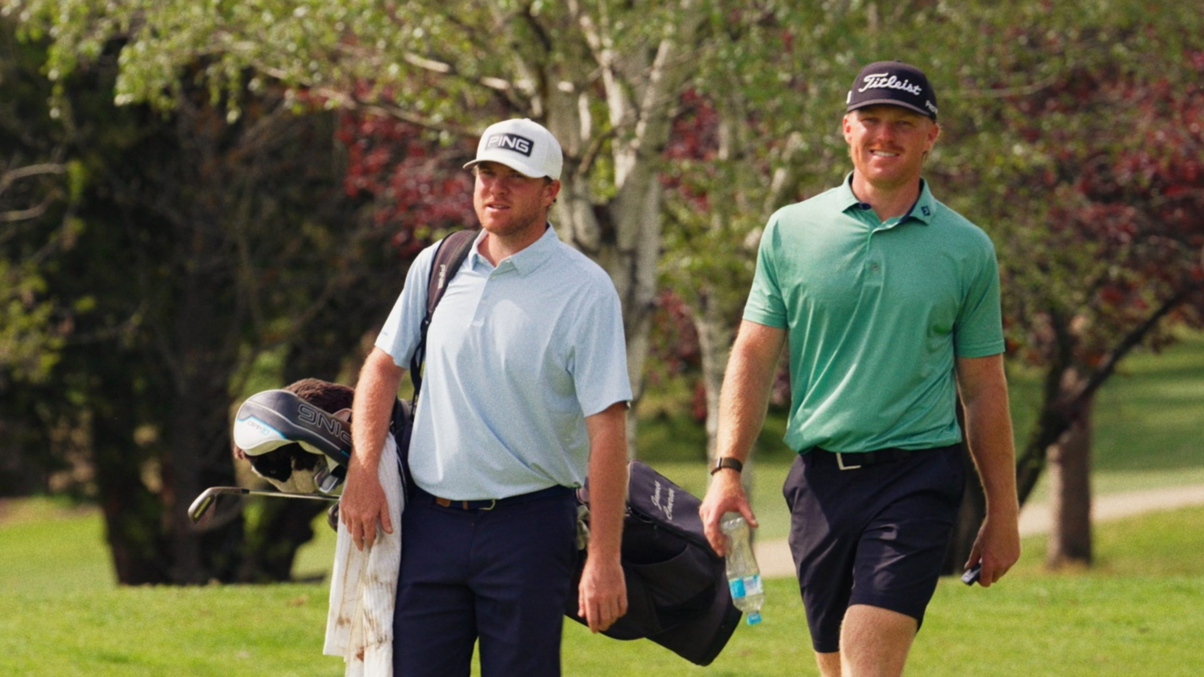James Conran and Jye Pickin walking along the fairway